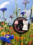 Broche chaton r&eacute;alis&eacute;e avec divers &eacute;l&eacute;ments de r&eacute;cup&eacute;ration