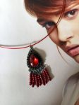 Pendentif réalisé à partir d'éléments de récupération(vendu avec tour de cou)